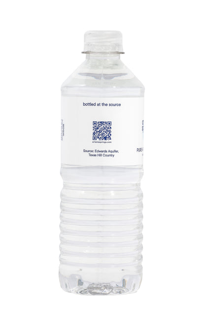Clear water bottle with a label on a white background