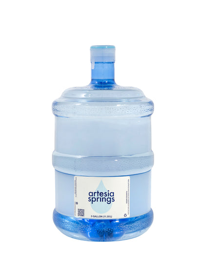 Large water bottle with 'artesia springs' label on a white background